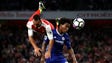Arsenal's Santi Cazorla collides with Chelsea's Willian.