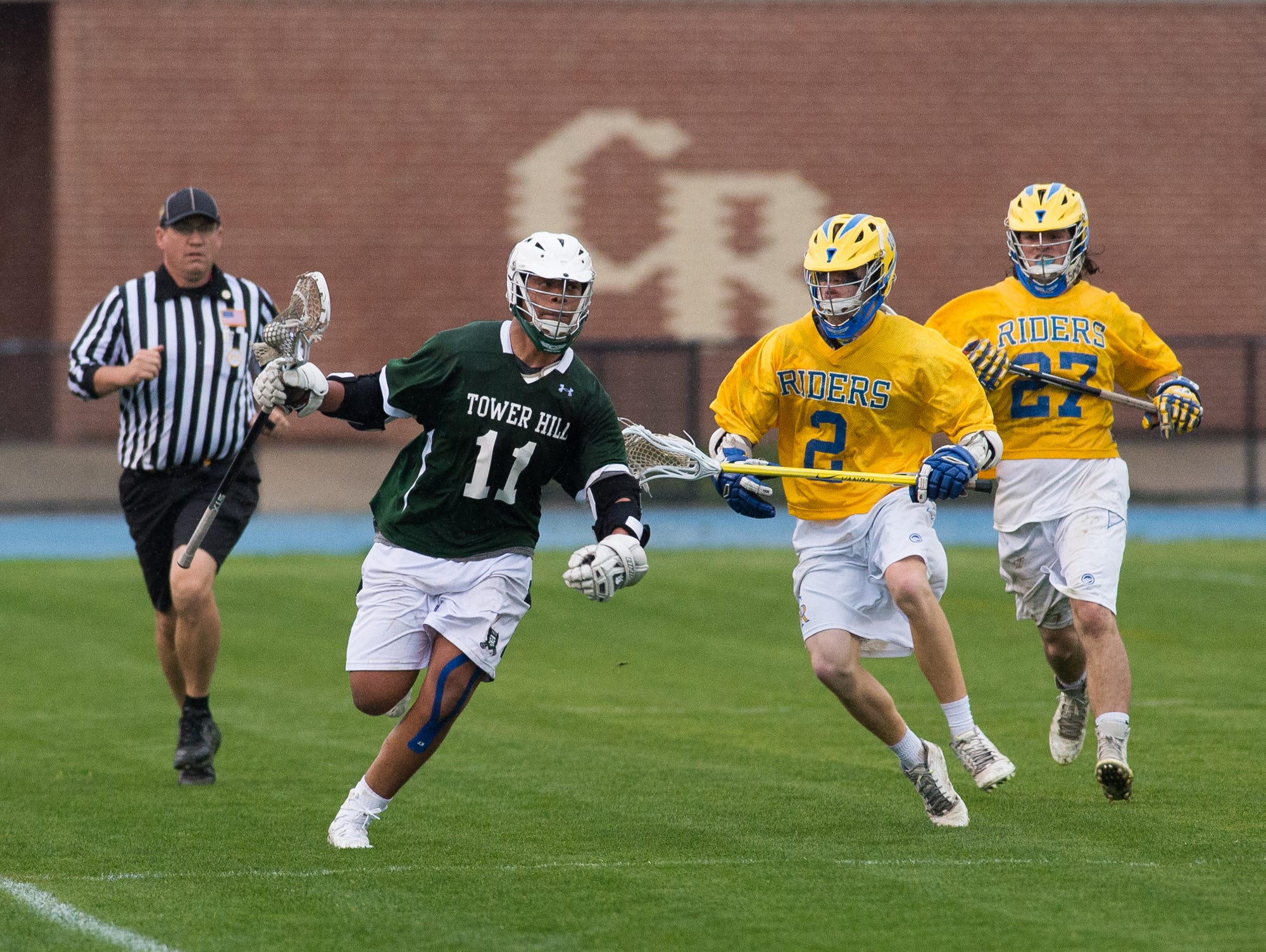 Tower Hills Noah Thomas (11) runs down the side line away from Caesar Rodney's players in their 11-9 win.