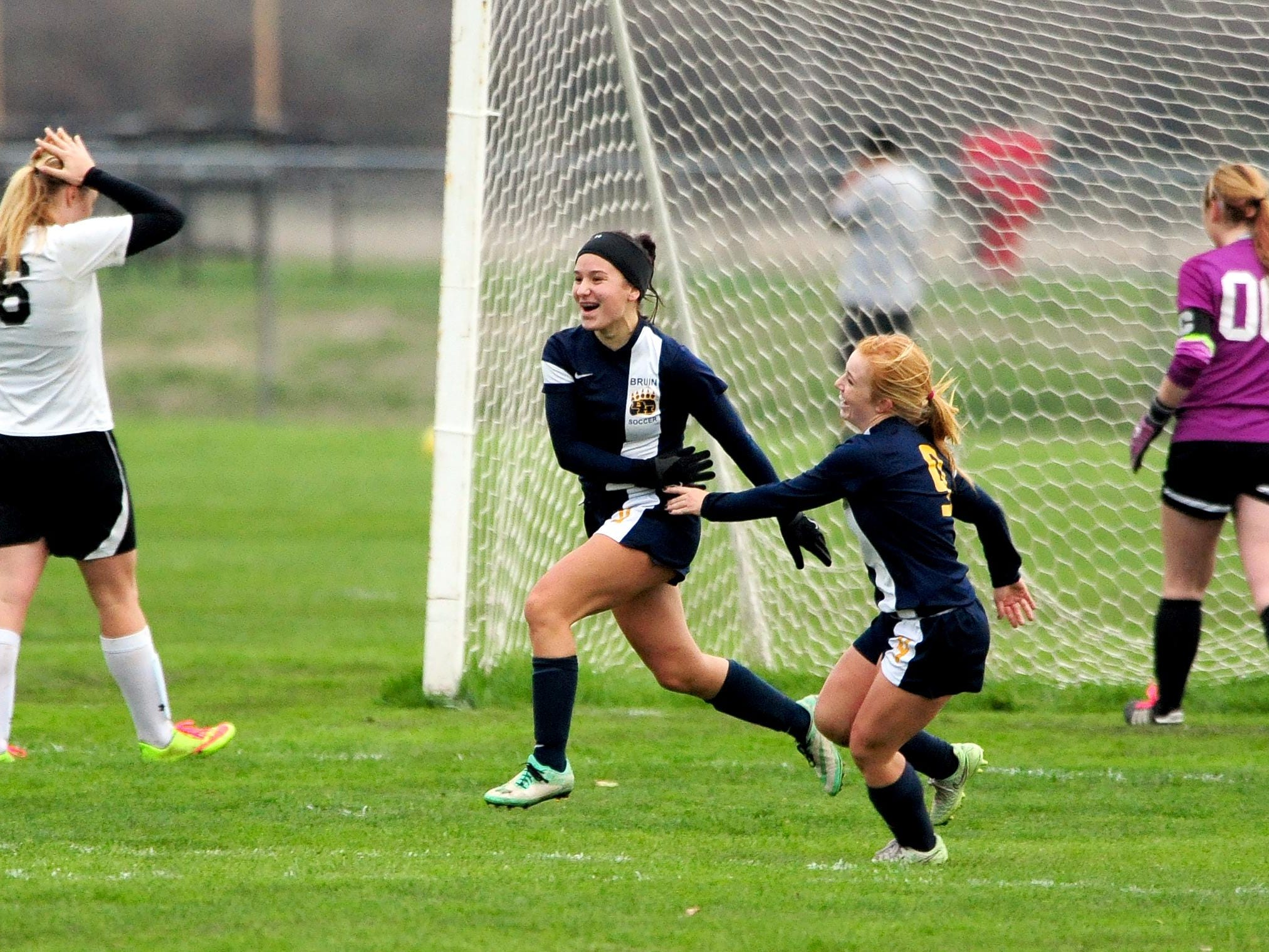 Brookings-Harbor forward Tyrah Baron, center, celebrates her second goal of the game against Cascade during the first round of the OSAA Class 4A state playoffs, Wednesday, November 4, 2015, at Cascade High School in Turner, Ore. Brookings-Harbor won the game 3-1.