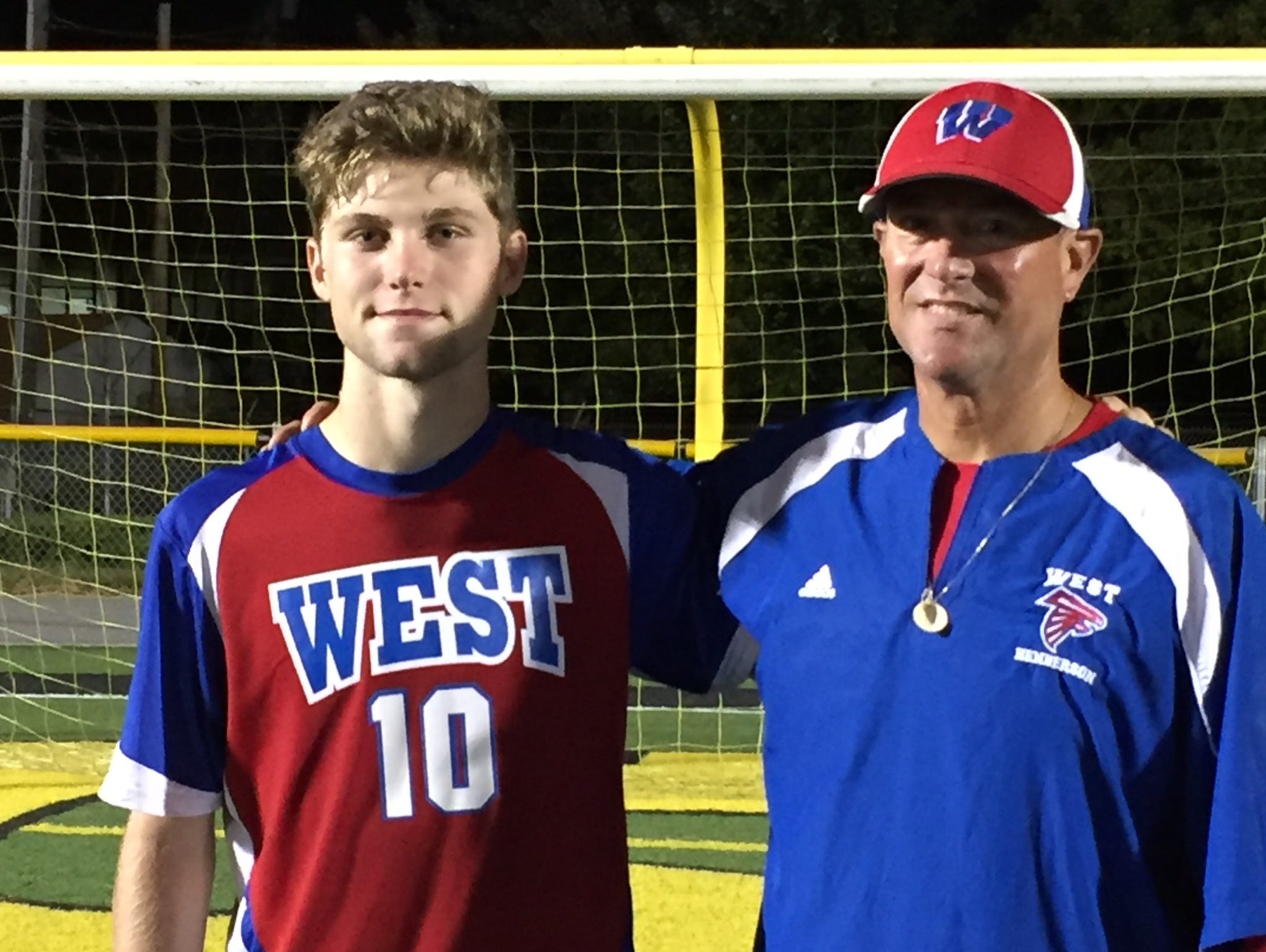 Tyson Hichman and West Henderson boys soccer coach Brian Brewer.