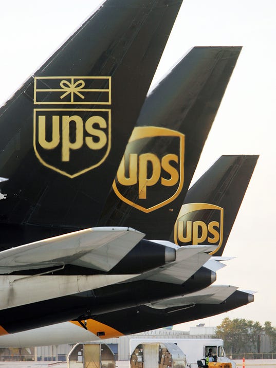 Image result for UPS, FedEx fight to stay ahead of gift package deluge