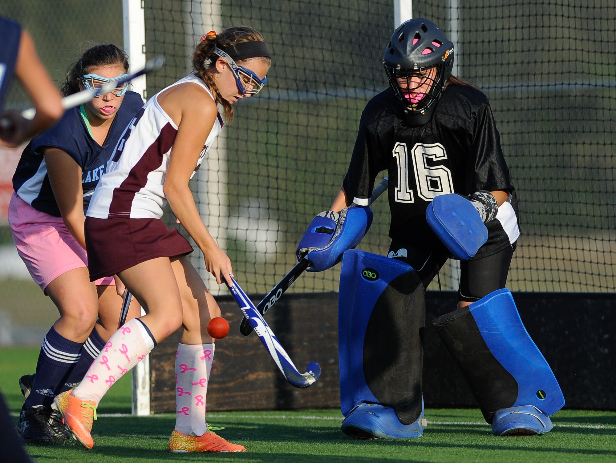 Lake Forest field hockey goalie Allison Bishop (No. 16) defends in their game against Milford.