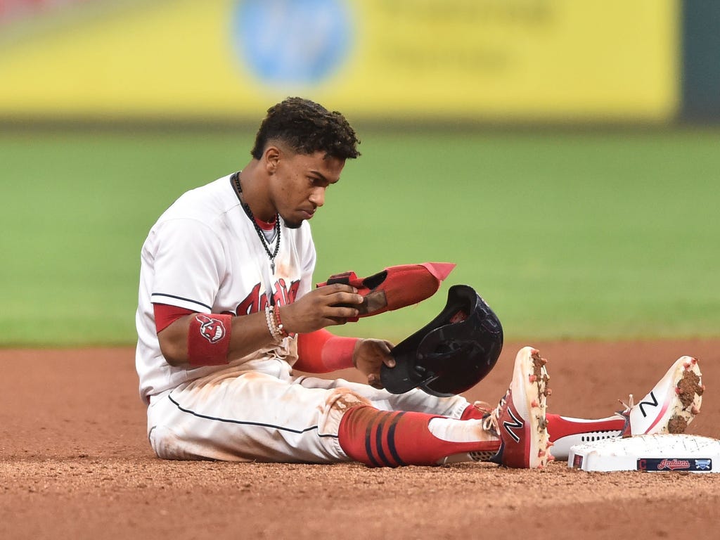 Indians runner Francisco Lindor hangs his head after being caught in a double play during the seventh inning against the Royals in Cleveland. Lindor and the Indians fell 4-3 and saw their AL-record win streak end at 22 games.