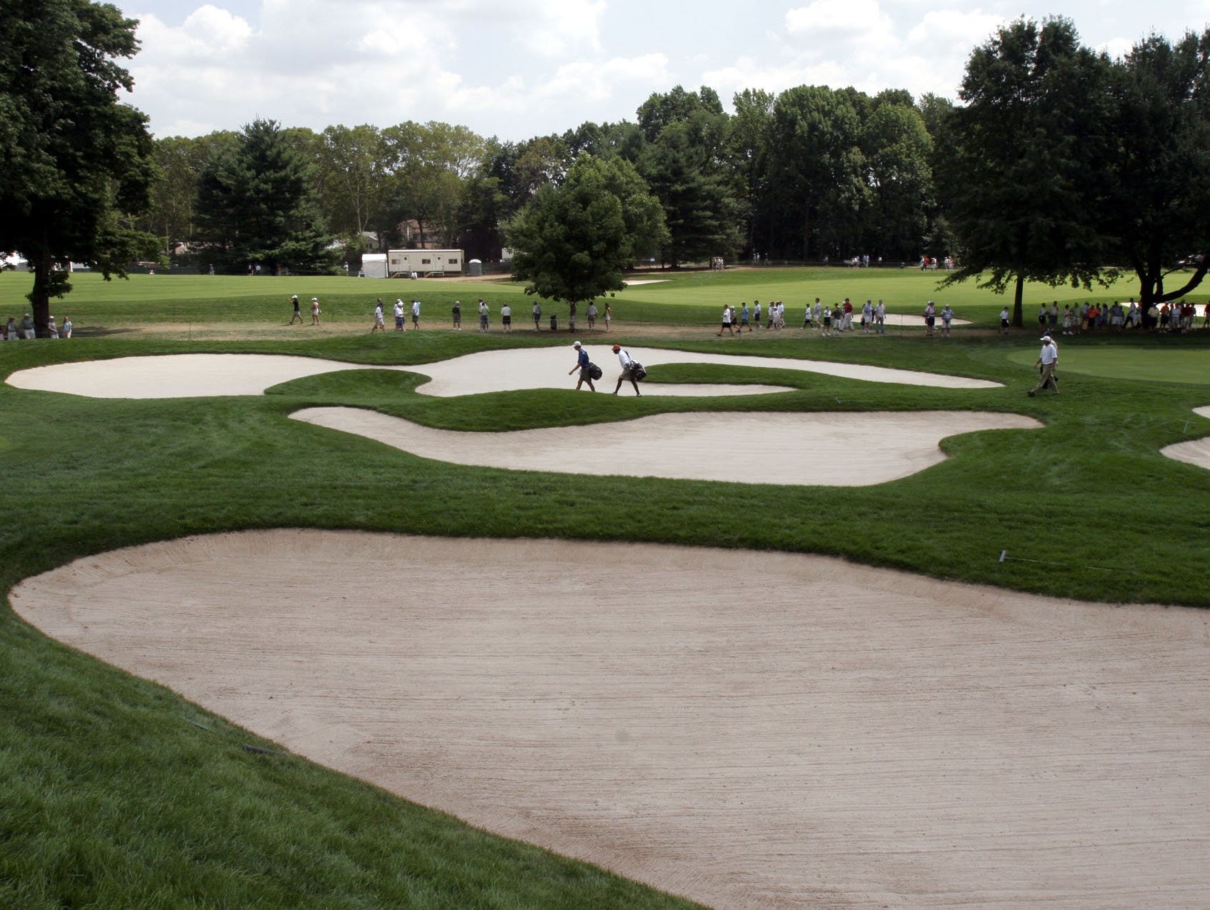- -Text: Tbound in the center of the par 5, 650 yard, 17th hole at the 87th PGA Championship at the Baltusrol Golf Club in Springfield, New Jersey, August 10, 2005. ( Mark Vergari / The Journal News )