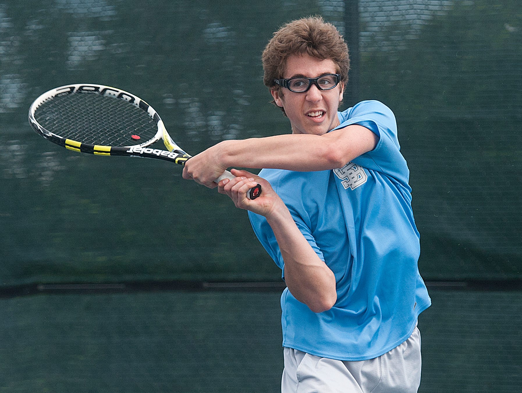 South Burlington’s Marco Cepeda hits the ball against a serve by Stowe’s Sam Salvas at the boys high school tennis championship last season.