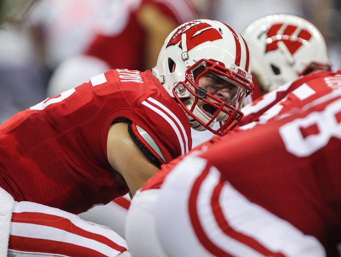 Wisconsin quarterback Tanner McEvoy barks out the signal at the line of scrimmage against LSU.