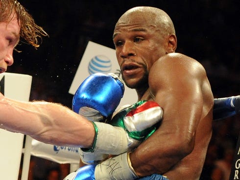 Floyd Mayweather Jr. and Canelo Alvarez compete during their during their WBC and WBA super welterweight titles fight at MGM Grand Garden Arena.