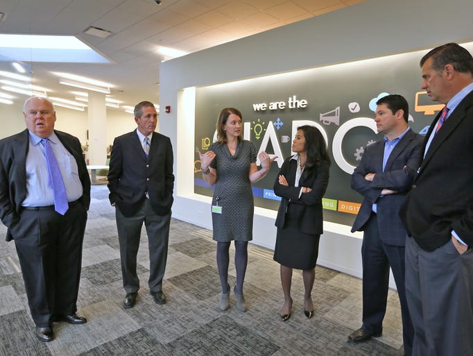 Publisher Karen Ferguson, center, leads a tour for