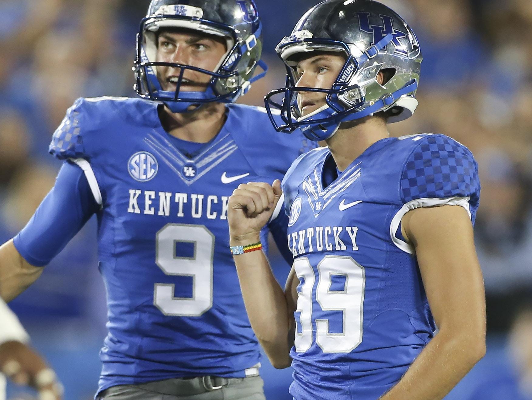 Kentucky kicker Austin MacGinnis, right, celebrates with punter Landon Foster after making a field goal during the second half of an NCAA football game against Florida, Saturday, Sept. 19, 2015, in Lexington, Ky. Florida won the game 14-9. (AP Photo/David Stephenson)