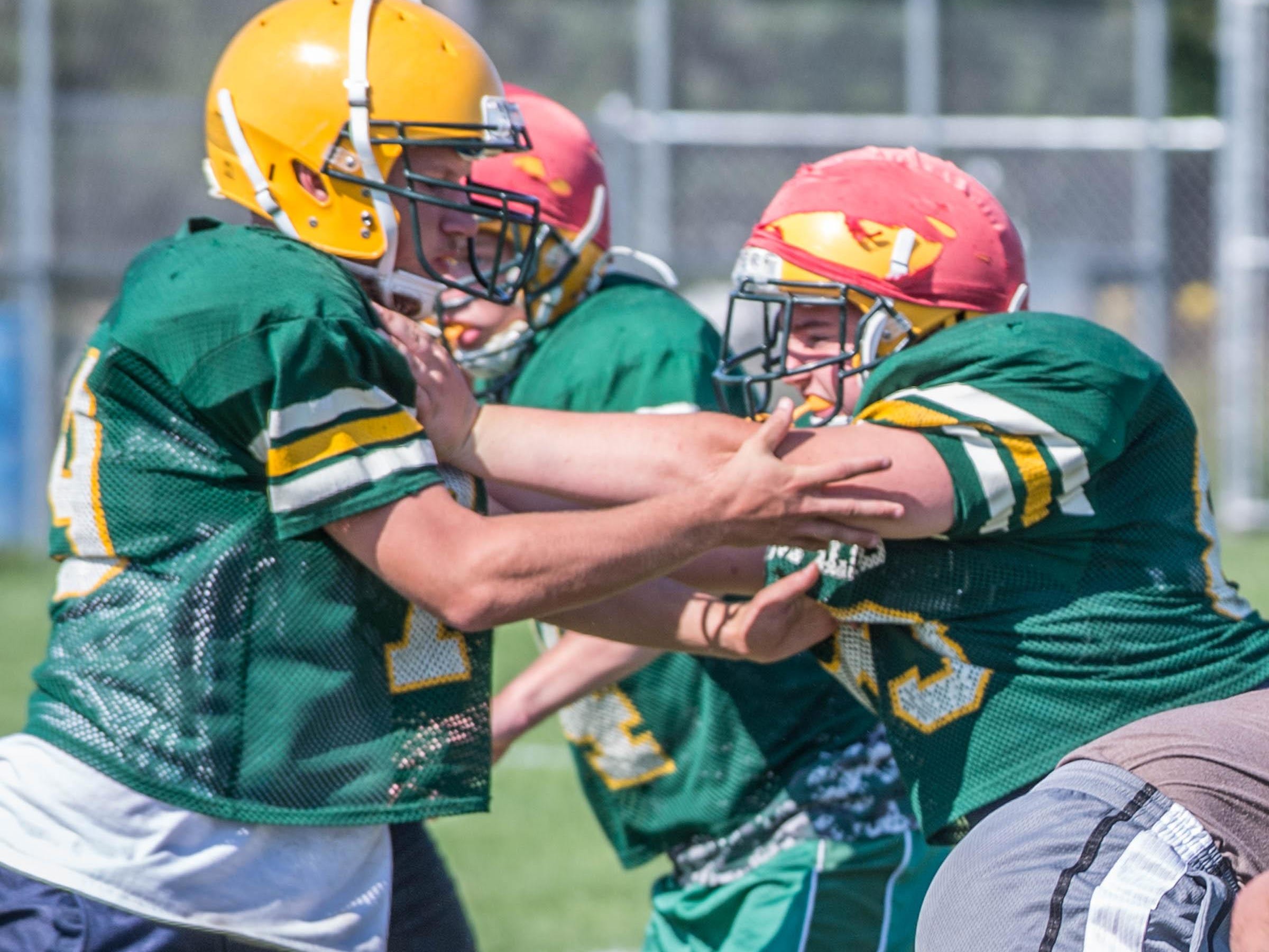 First day of practice with full pad for Pennfield High School football team.