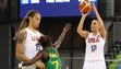 United States guard Diana Taurasi shoots while being