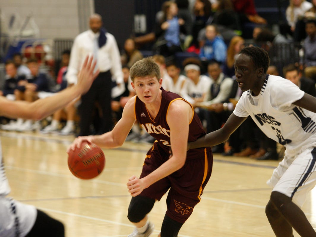Ankeny's Trystan Cummins drives to the basket during a game at Des Moines Roosevelt on Dec. 1. Cummins scored 12 points as the Hawks opened their season with a 52-47 victory.