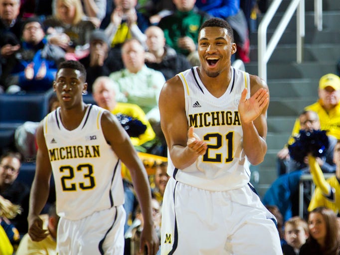 Michigan guard Zak Irvin (21) reacts after a basket