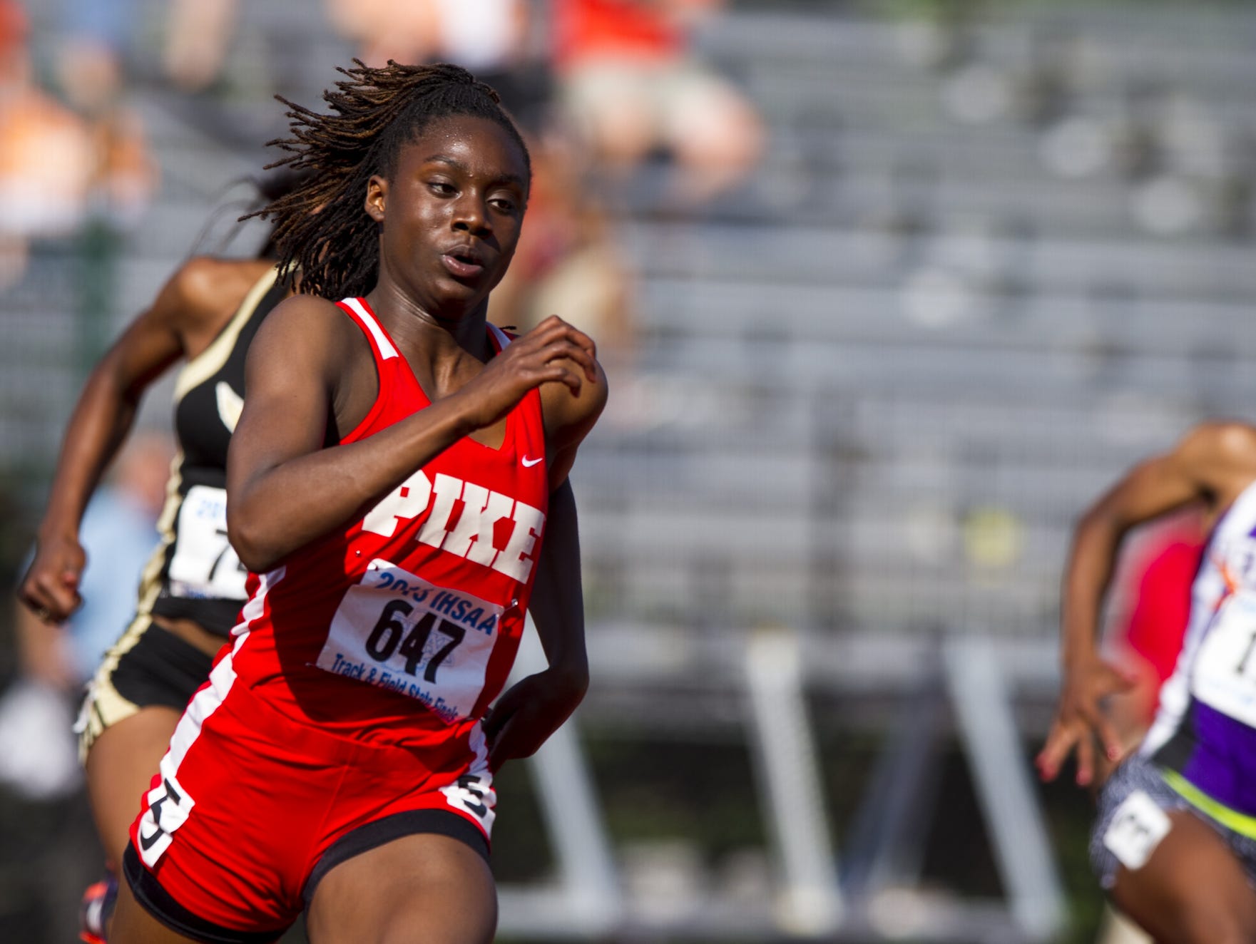 Pike High School sophomore Lynna Irby (647) competes in the 200 Meter Dash. The 42nd Annual Girl's Track and Field State Finals were held Saturday, June 6, 2015, at the Robert C. Haugh Track and Field Complex on the campus of Indiana University in Bloomington, Ind.