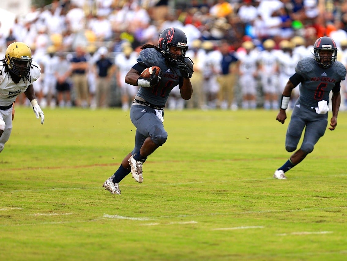 Wakulla running back Demarcus Lindsey rushes for a 24-yard touchdown in the first quarterback of the War Eagles' game against Spartanburg.