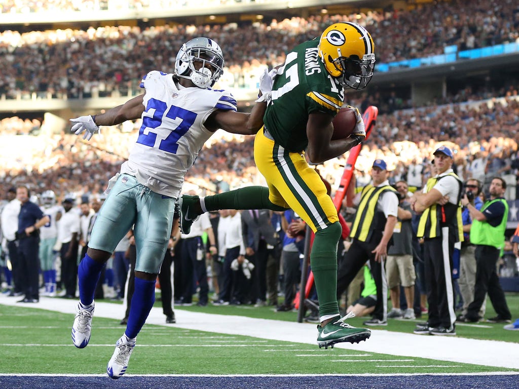 Green Bay Packers wide receiver Davante Adams scores the game-winning touchdown against Dallas Cowboys cornerback Jourdan Lewis in Dallas.