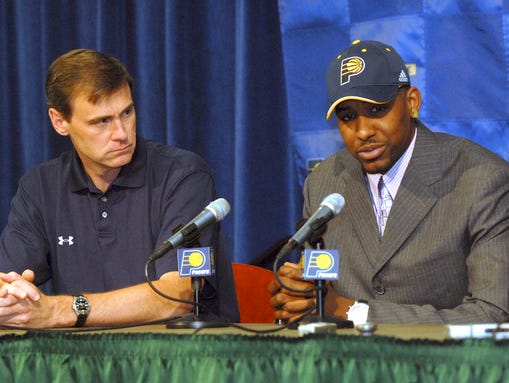 Indiana Pacers coach Rick Carlisle, left, listens as