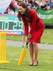 Kate, playing cricket in Latimer Square in Christchurch,