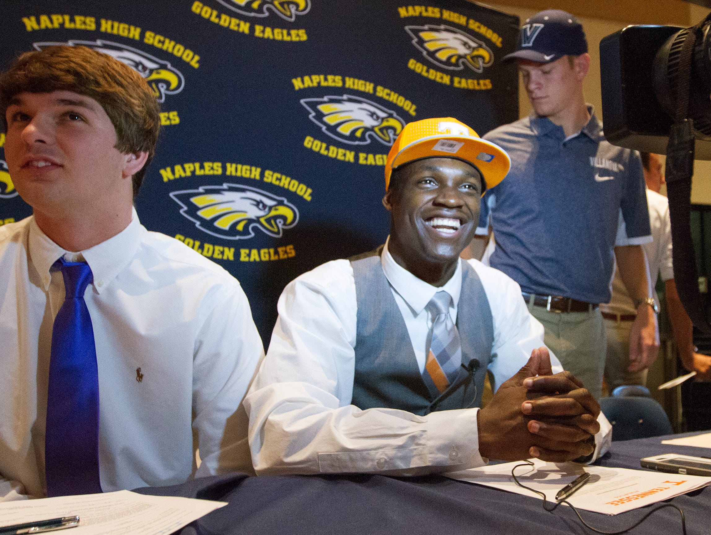 Naples High School’s Carlin Fils-aime was among the school’s athletes who signed National Letters of Intent Wednesday at the school. Fils-aime will play football at the University of Tennessee.