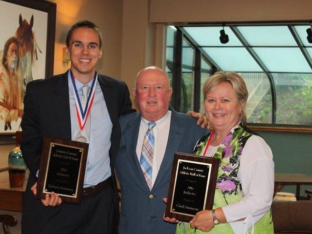 The mother-son combination of Cindi Simmons and Jackson Simmons joined Jackson County's athletic hall of fame last weekend.