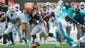 Cleveland Browns running back Trent Richardson (33) runs through Miami Dolphins strong safety Chris Clemons (30) and Miami Dolphins linebacker Jonathan Freeny (56) during the first quarter at FirstEnergy Stadium.