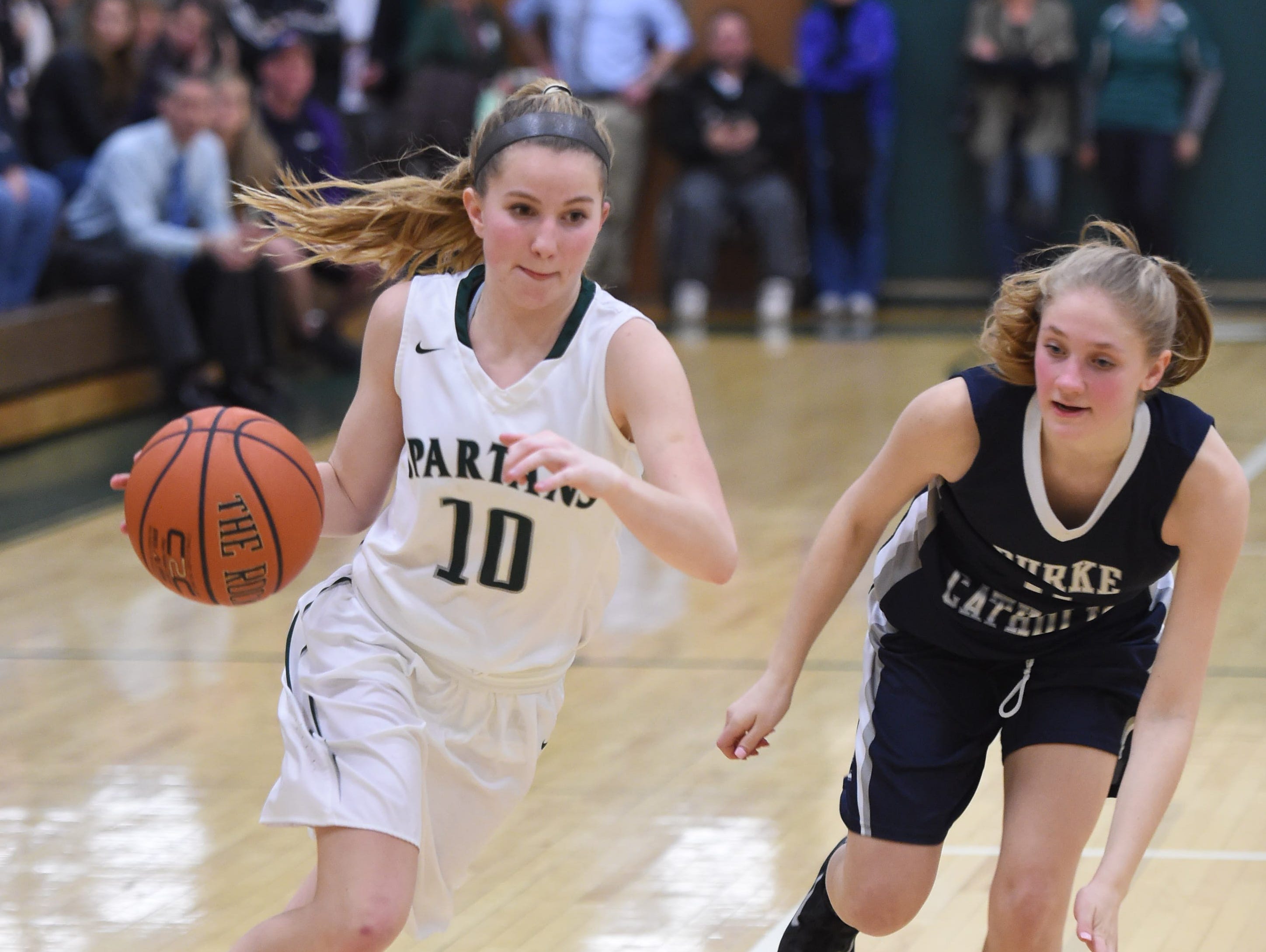 Spackenkill's Katherine Lillis dribbles past Burke's Mary Costa during Friday's Section 9 Class B semi-final at Spackenkill.