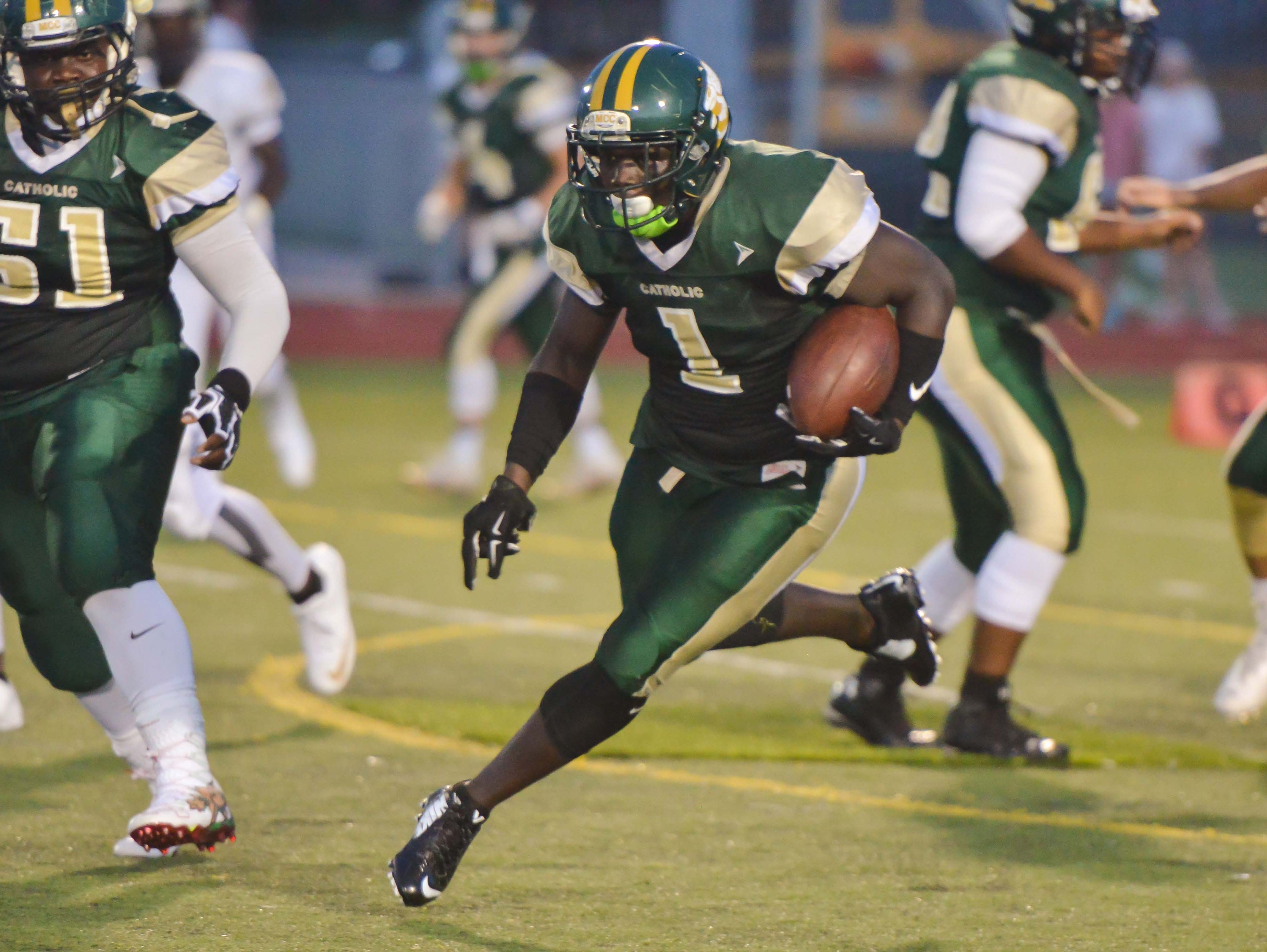 Pavis Gray runs for some yardage against Holy Trinity.