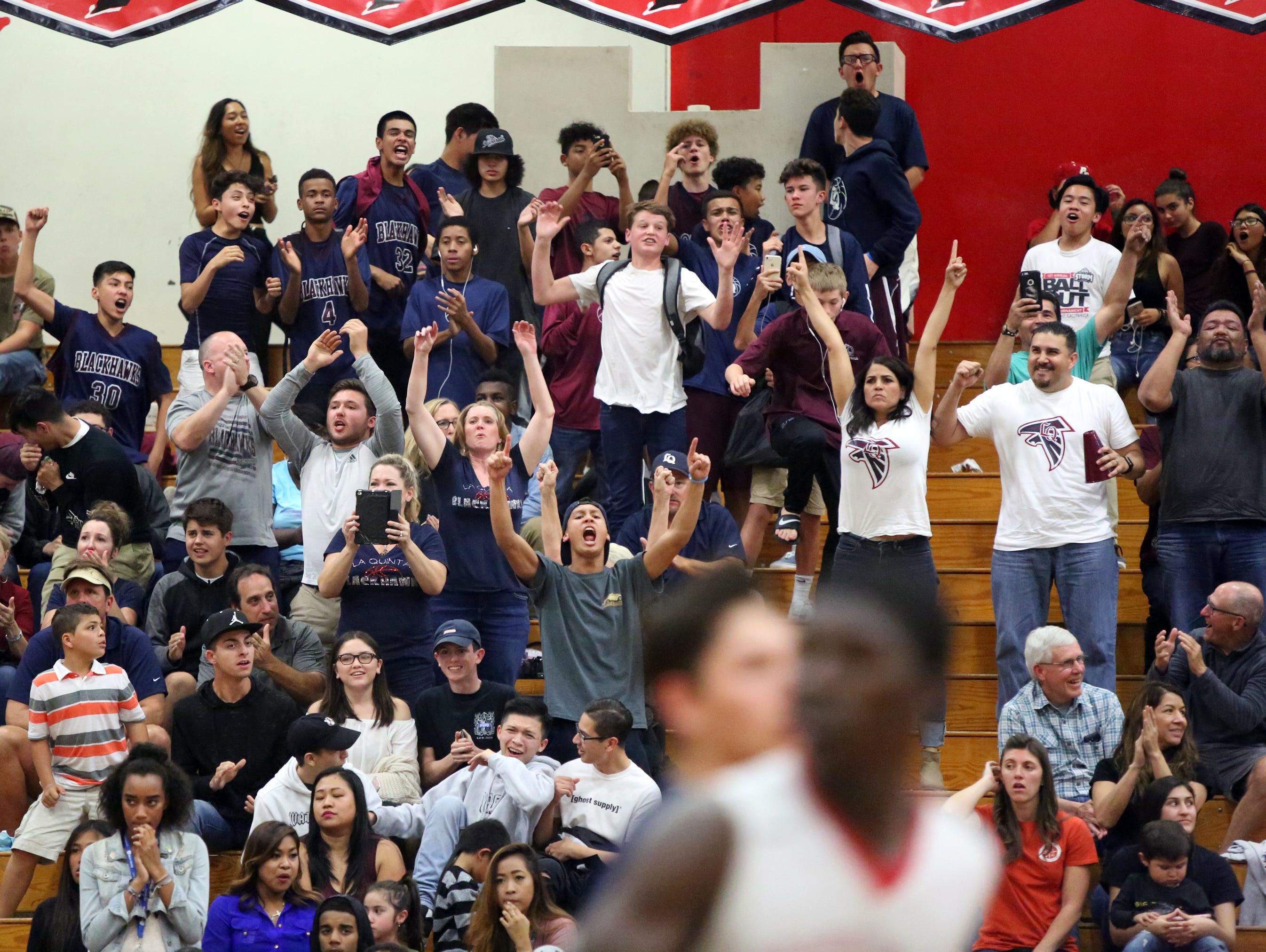 La Quinta varsity basketball fans celebrate a point during the teams overtime win against Palm Springs on Friday, February 10, 2017.