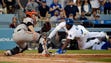 April 17: Dodgers outfielder Yasiel Puig slides safely