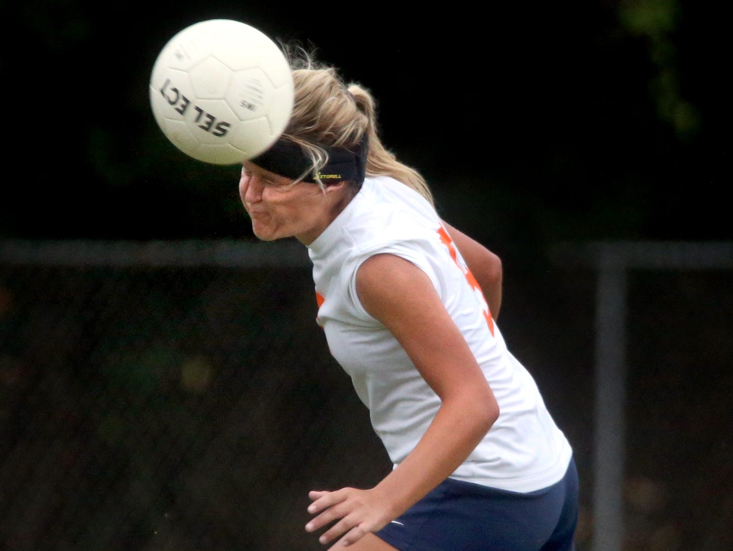 Blackman's Kenzi Vetter heads the ball during a game against Smyrna. The Blackman soccer team wears Storelli head bands to help reduce the risk of concussions.