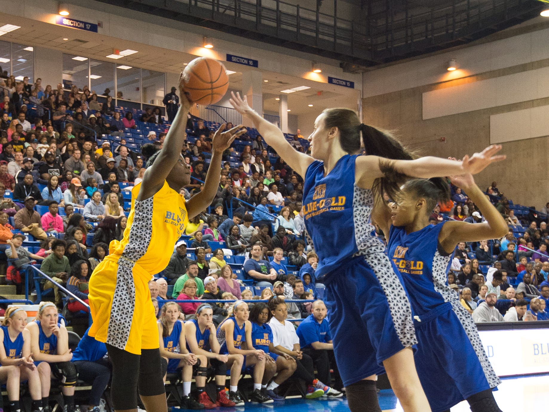 Gold Girls All-Star Daia Daniels (5) of Lake Forest jumps up for a shot attempt in the Blue Gold All-Star girls basketball game at the University of Delaware.