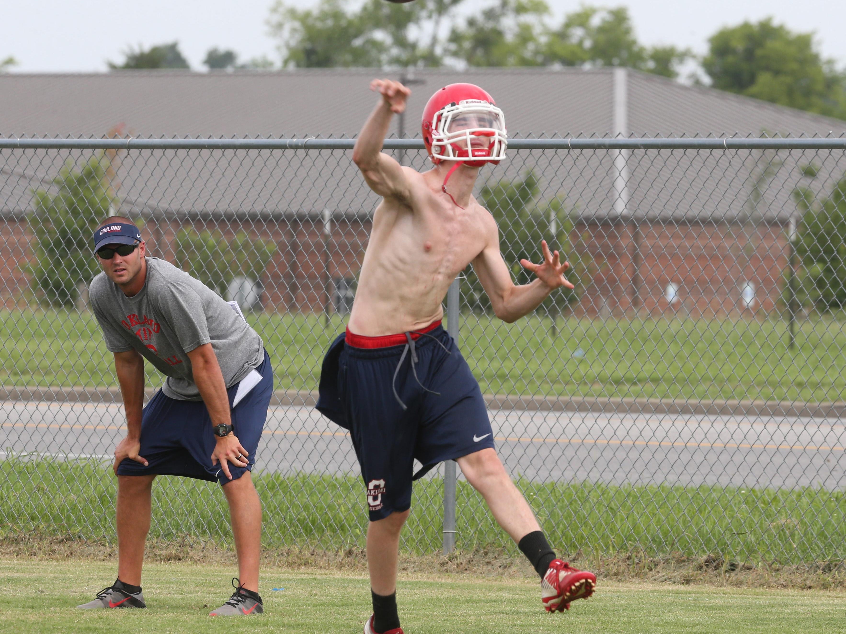 Oakland junior Cody Miller is competing with Brendan Matthews for the starting quarterback position.
