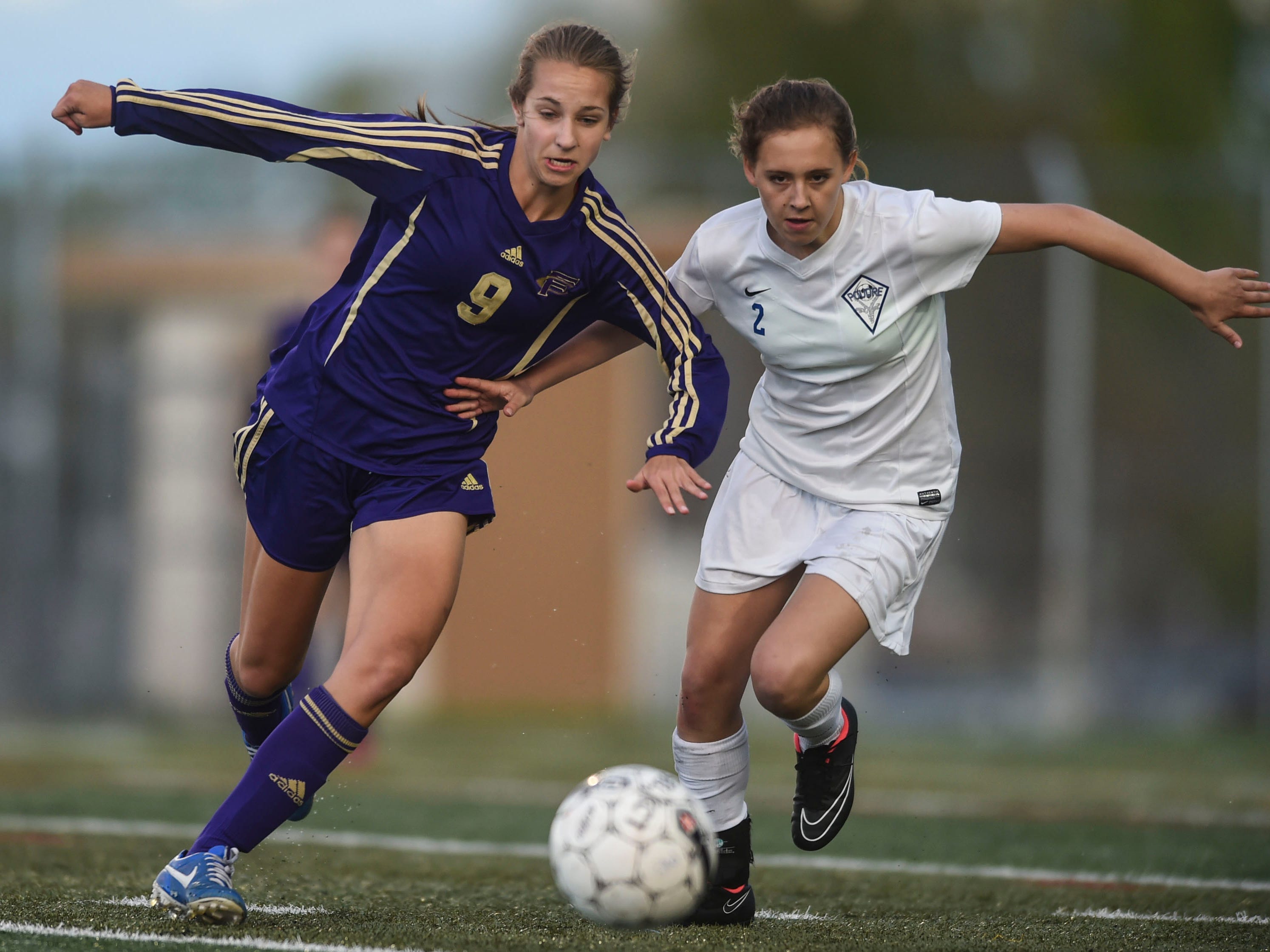 Fort Collins’ Bailey Nemechek, left,and Poudre’s Sierra Paulsen chase down a ball Thursday night during a game at French Field. Poudre won 2-1.