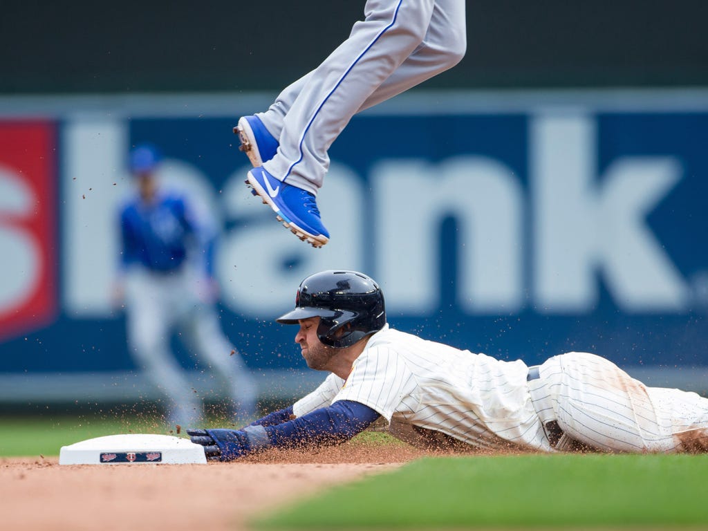 Minnesota Twins second baseman Brian Dozier steals second in the seventh inning against the Kansas City Royals at Target Field in Minneapolis. The Minnesota Twins beat the Kansas City Royals 9-1.