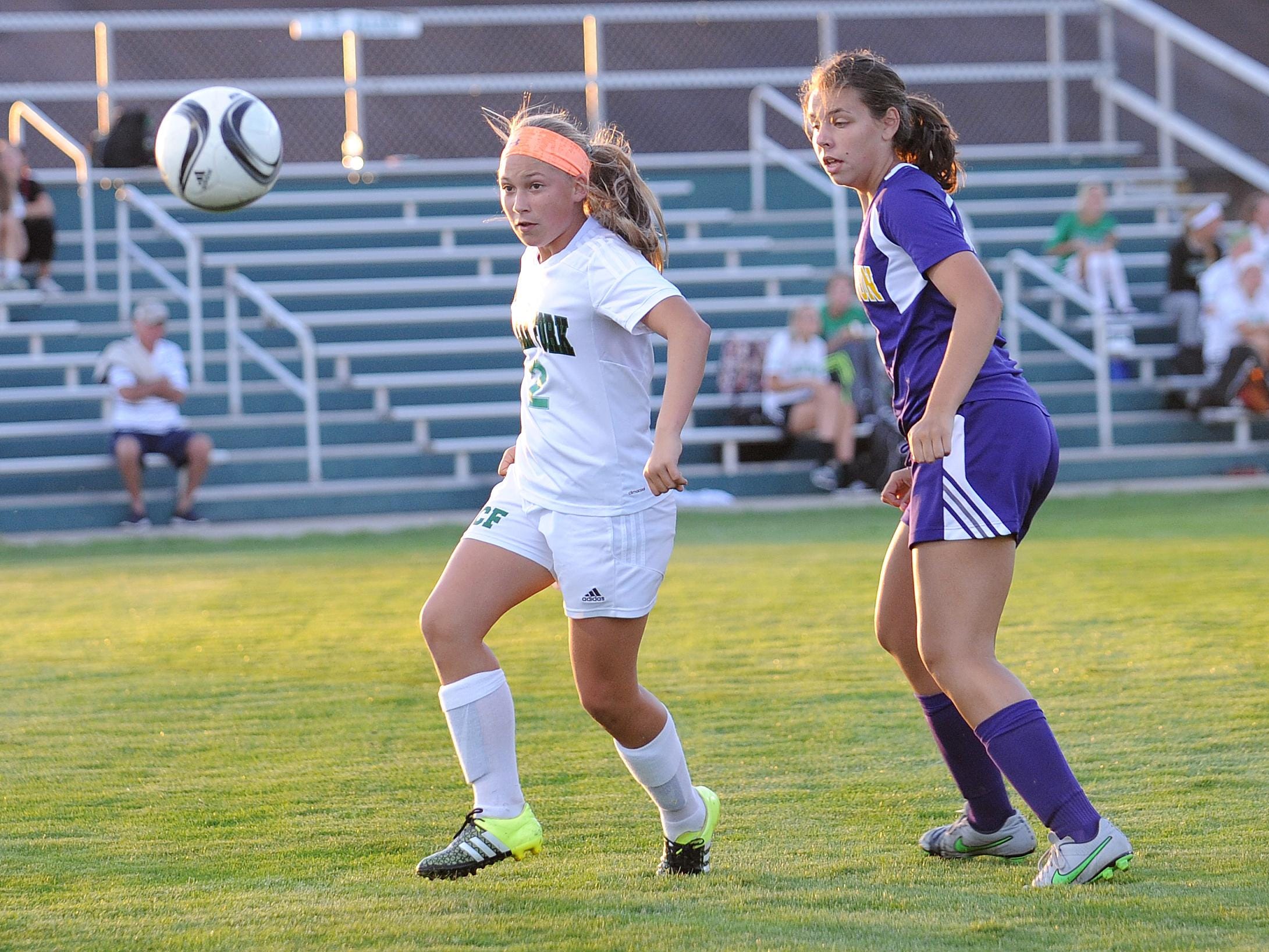 Clear Fork's Kaylin Helinski battles for control over the ball Tuesday evening during their game against Lexington.
