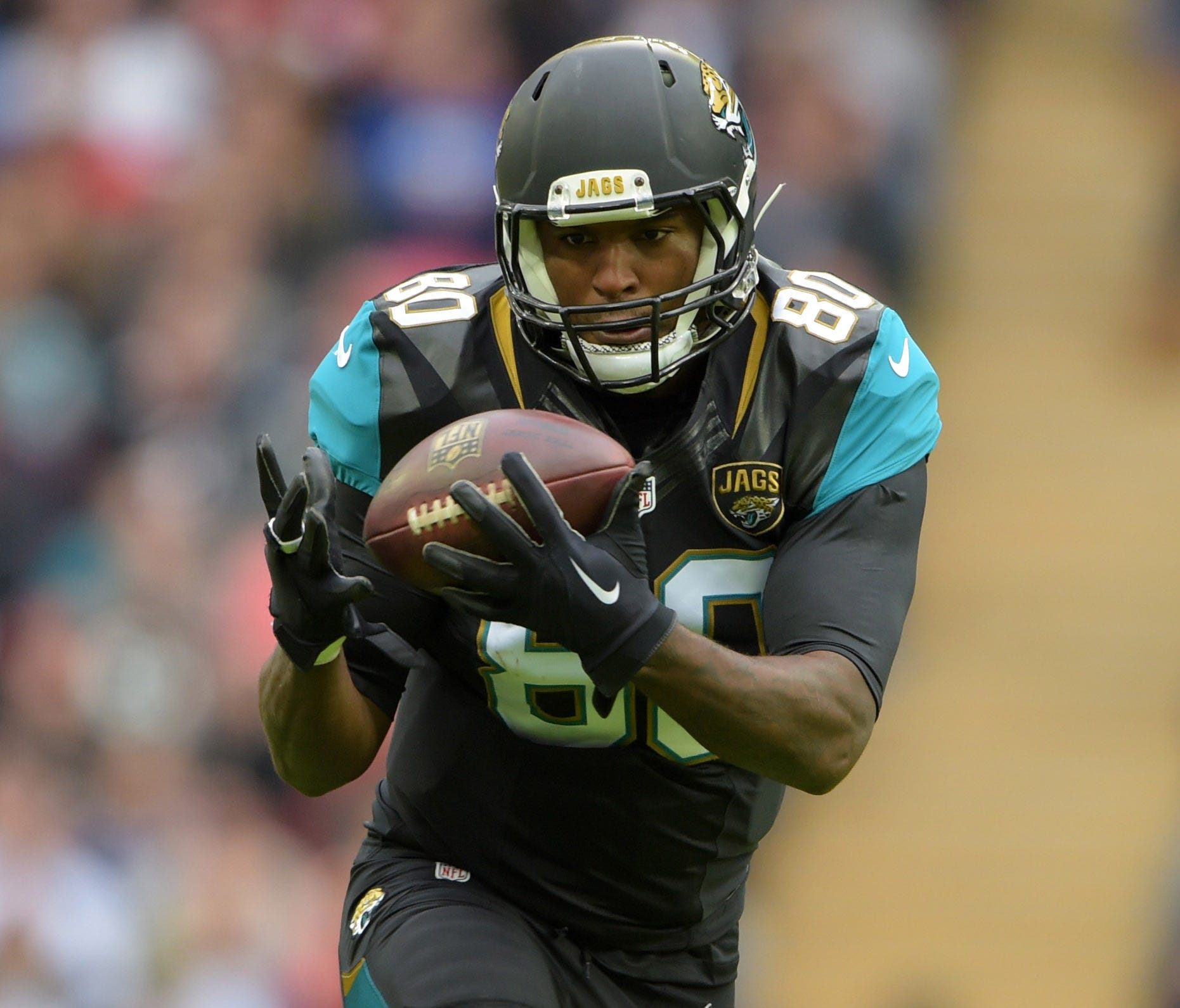 Jacksonville Jaguars tight end Julius Thomas (80) catches a pass against the Buffalo Bills during NFL International Series game at Wembley Stadium.