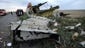 Wreckages from the crashed Malaysia Airlines jet rests on a road near Shaktarsk in rebel-held east Ukraine.