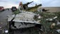 Wreckages from the crashed Malaysia Airlines jet rests on a road near Shaktarsk in rebel-held east Ukraine.