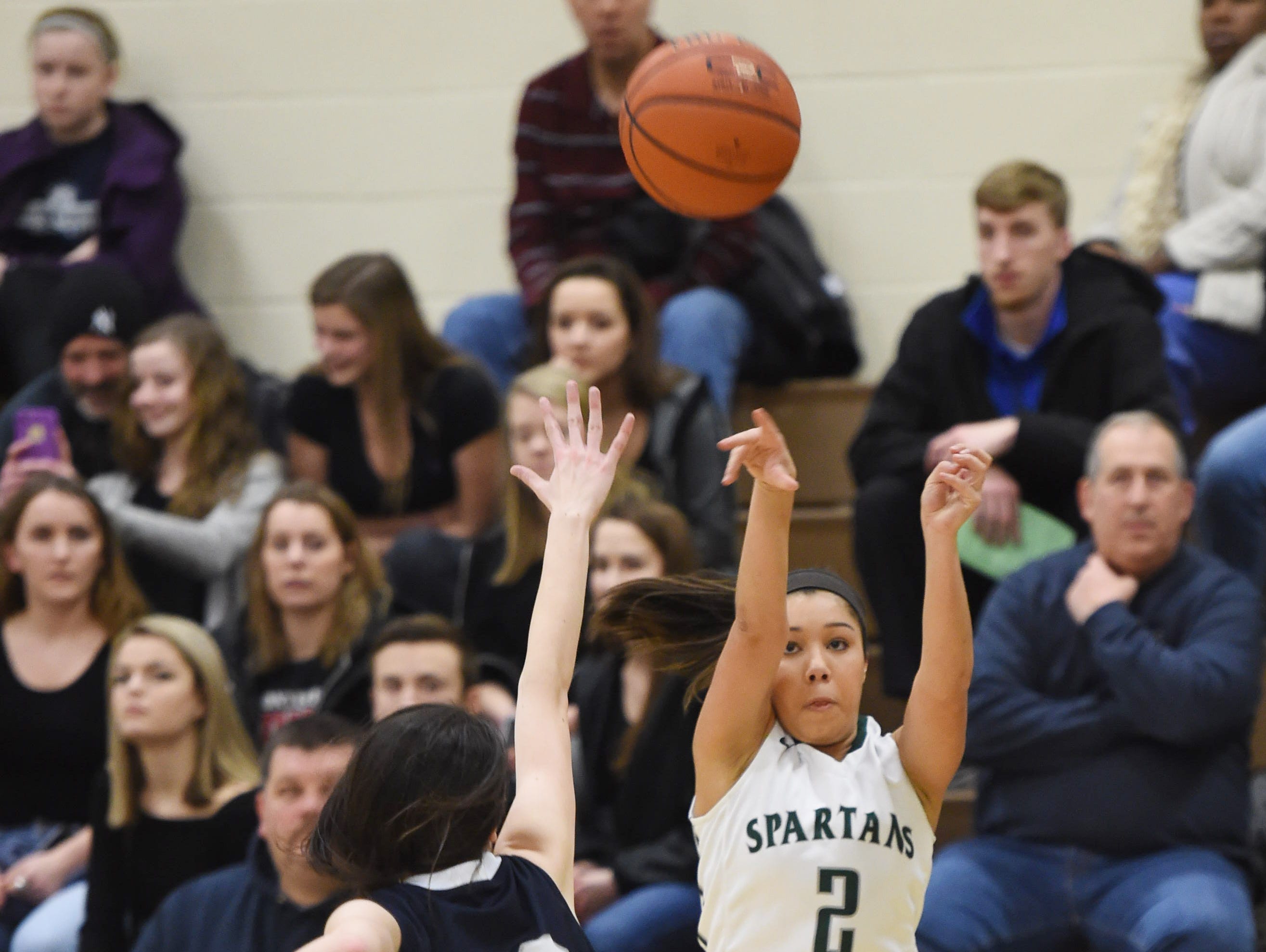 Spackenkill's Isabelle Herrera takes a shot over Burke's Carrington Percarpio during Friday's Section 9 Class B semi-final at Spackenkill.