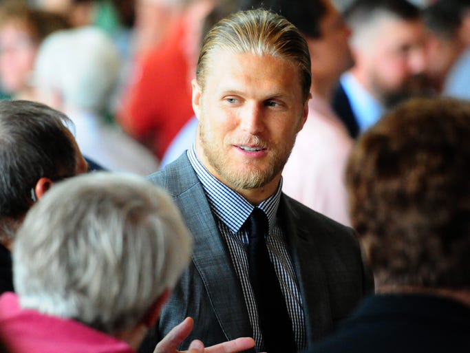 Green Bay packers linebacker Clay Matthews talks to guests during the 51st annual Welcome Back Packers Luncheon at the Lambeau Field Atrium, Wednesday, August 27, 2014.