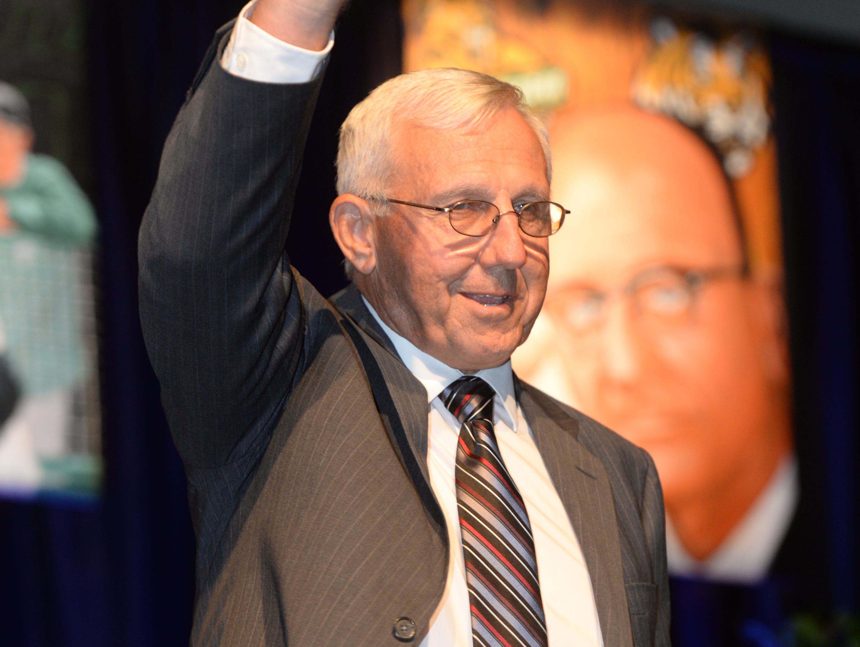 Jim Hightower waves as he walks up on stage during his induction into the 2016 Louisiana Sports Hall of Fame.