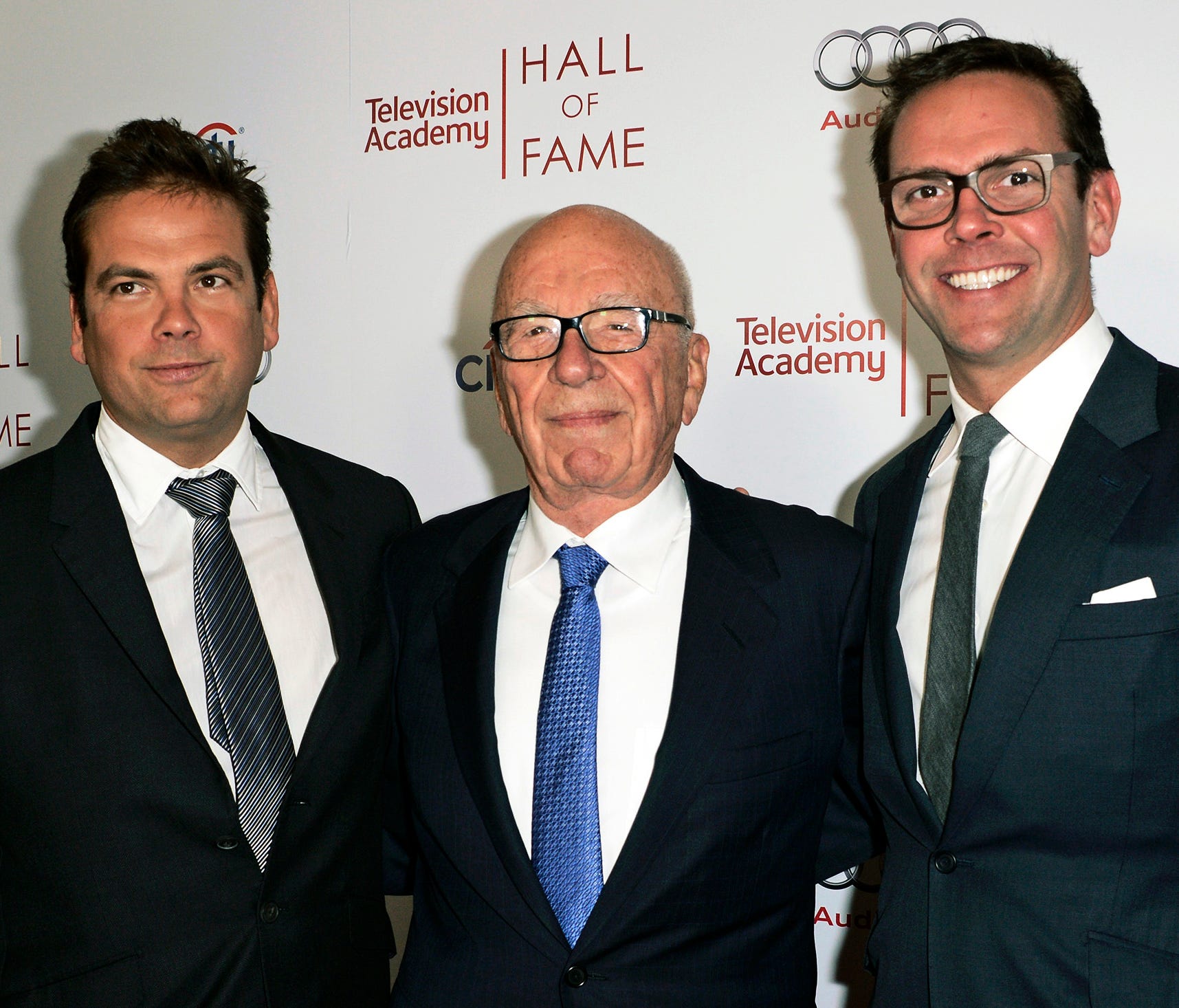 In this March 11, 2014 file photo, News Corp. Exeuctive Chairman Rupert Murdoch, center, and his sons, Lachlan, left, and James Murdoch attend the 2014 Television Academy Hall of Fame in Beverly Hills, Calif.