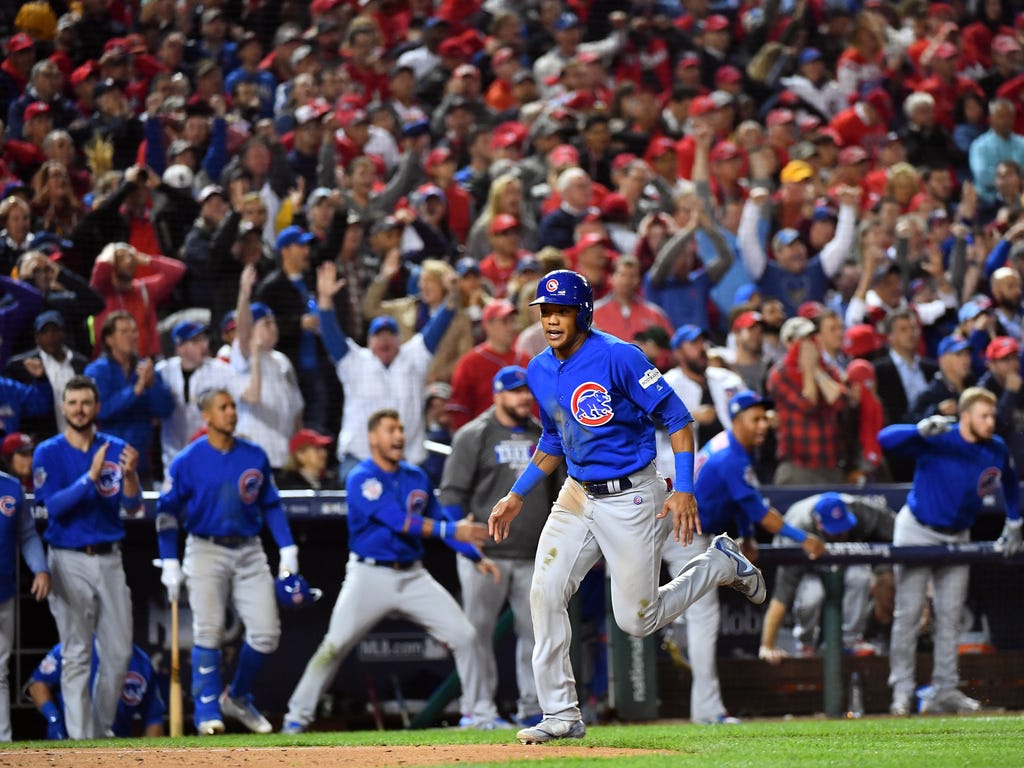 Chicago Cubs shortstop Addison Russell scores in the fifth inning during game five of the 2017 NLDS playoff baseball series against the Washington Nationals at Nationals Park in Washington.