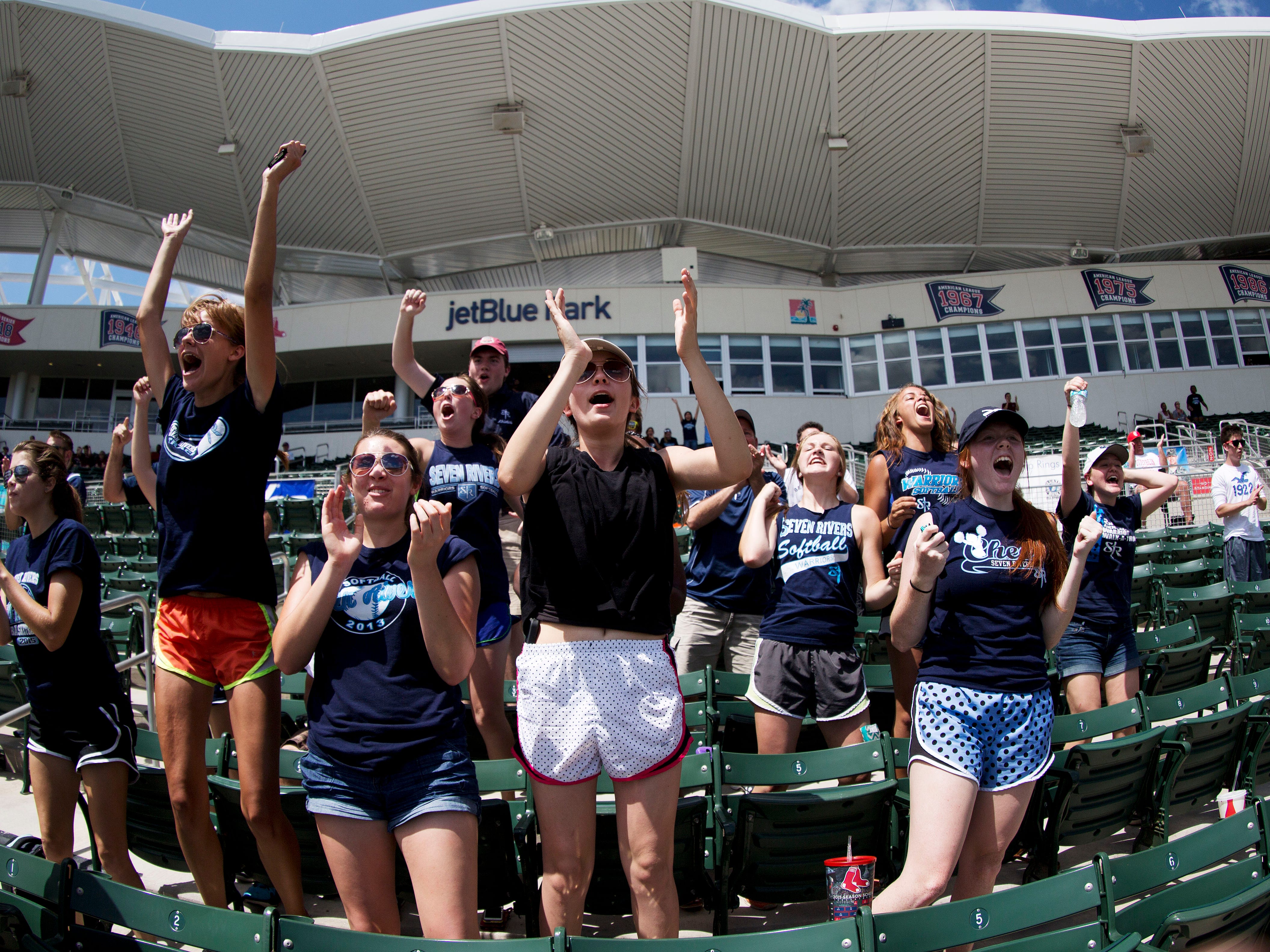 Students of Seven Rivers Christian School cheer on their team in the FHSSA state 2A baseball semi-final games against Bayshore Christian School on Wednesday. Seven Rivers ended up losing in 11 innings 4-3.
