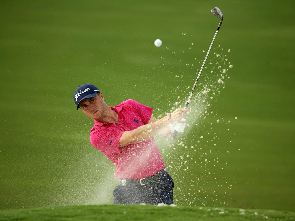 Justin Thomas plays from a bunker on the 16th hole during the final round of the PGA Championship at Quail Hollow Club in Charlotte, N.C.