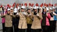 Young women participate in a rehearsal ahead of the