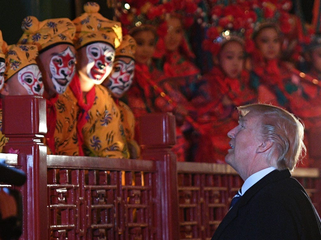 President Trump talks to opera performers at the Forbidden City in Beijing on Nov. 8, 2017. Trump toured the Forbidden City with Chinese leader Xi Jinping on Nov. 8 as he began the crucial leg of an Asian tour intended to build a global front against
