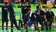 The USA bench reacts against Serbia in the men's basketball