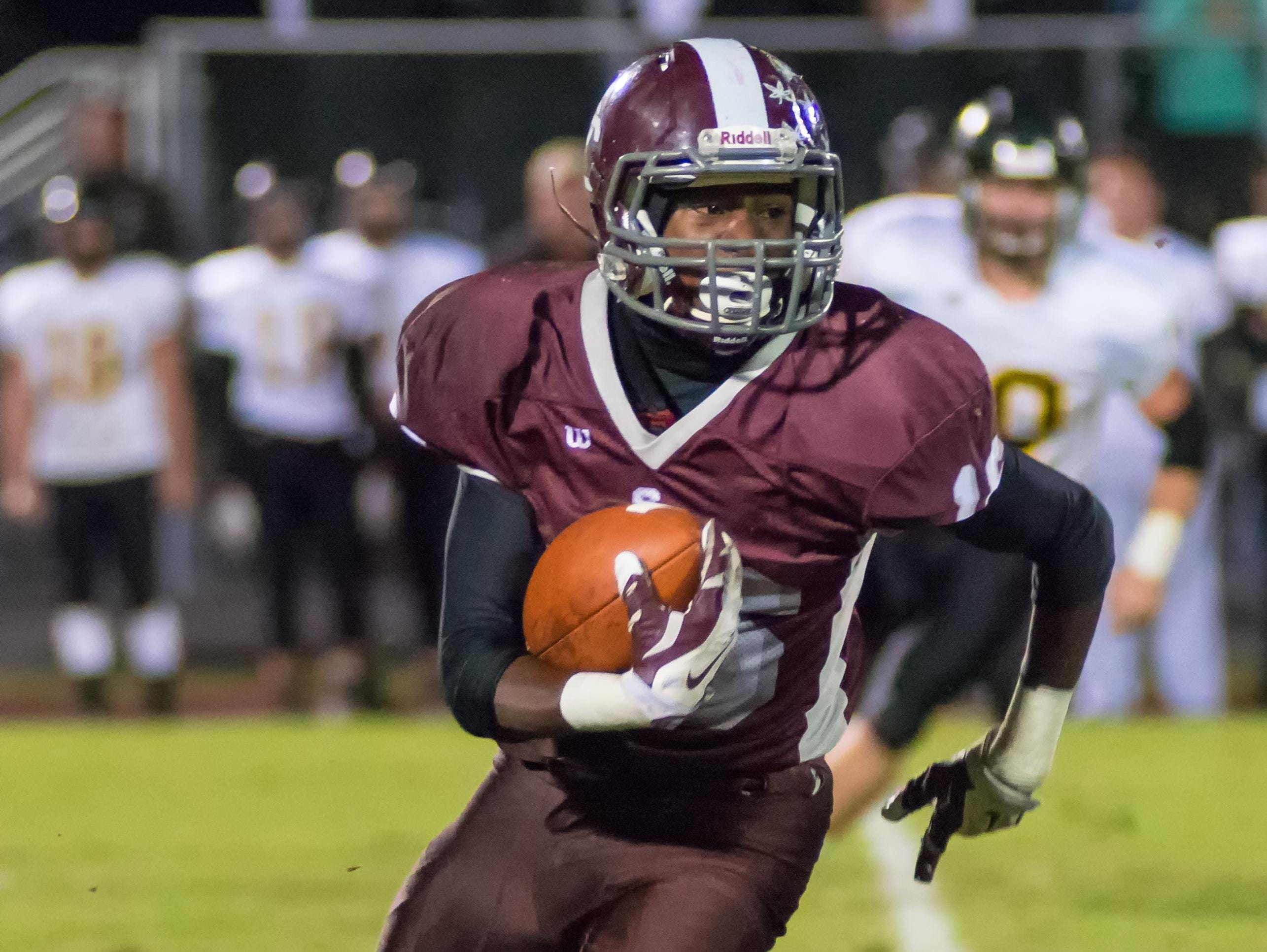 Station Camp High senior Perry Foxx carries the football during a contest earlier this season against Hendersonville. The Bison must win their final two games in order to have an opportunity to qualify for the playoffs.