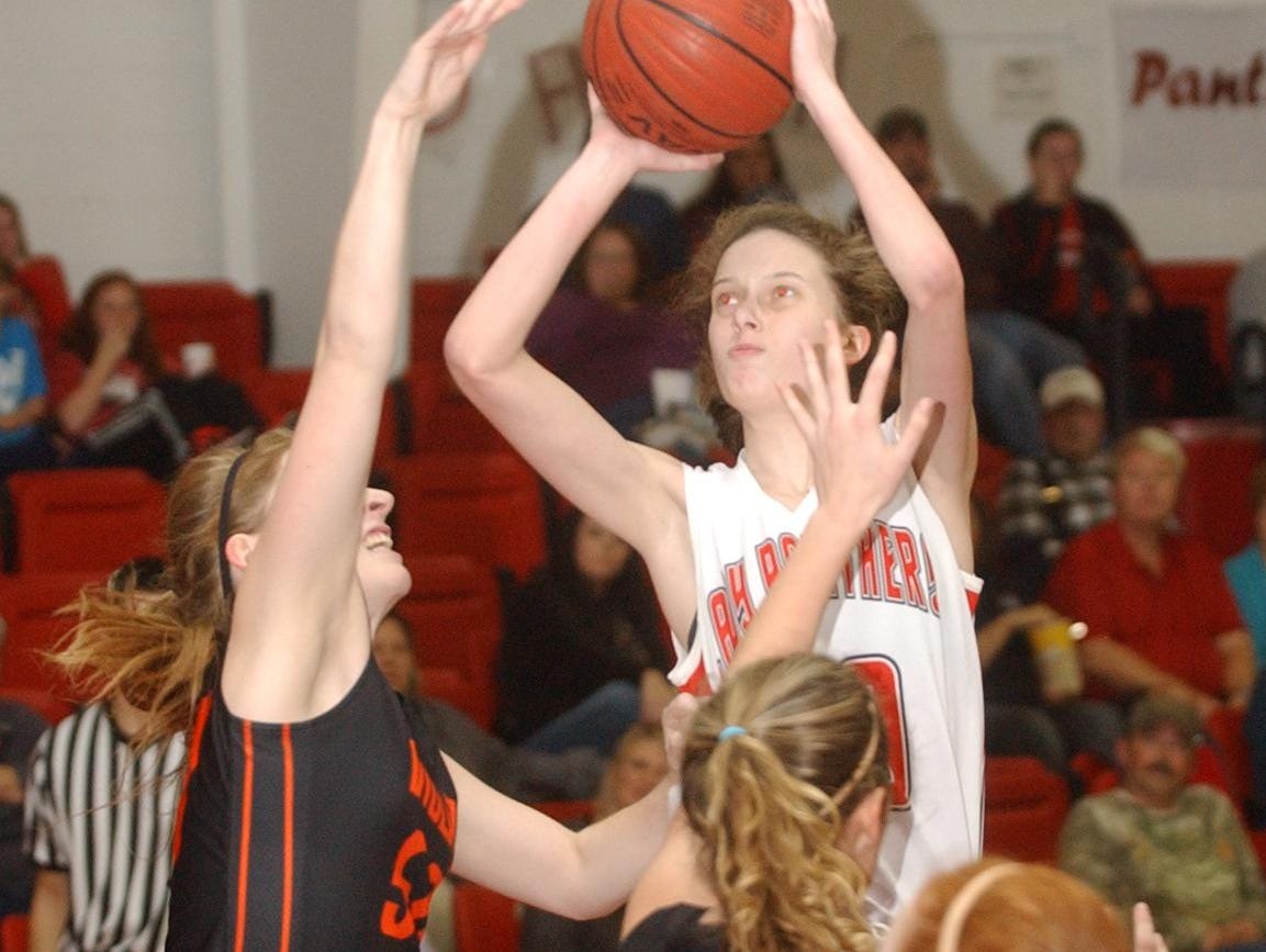 Norfork’s Marleigh Dodson shoots over Viola’s Amanda Martin, left, and Destiny Crawford during the Lady Panthers’ 55-30 victory over the Lady Longhorns on Tuesday night at Norfork.